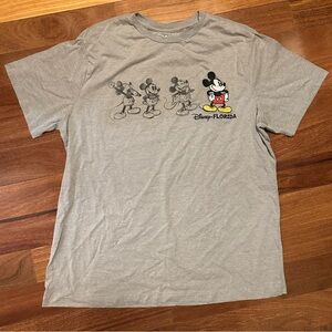 Disney Gray Mickey Evolution Graphic Tee with Red & Yellow Accents
